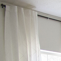 How to hang tab-top curtains so they look like back-tab panels -- plus other brilliant DIY curtain hacks