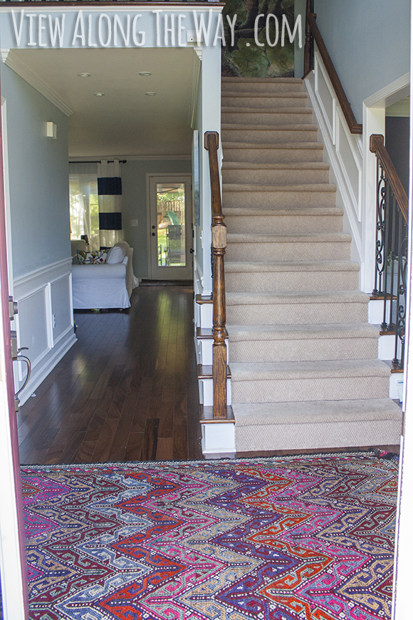 Entryway with colorful Turkish kilim rug