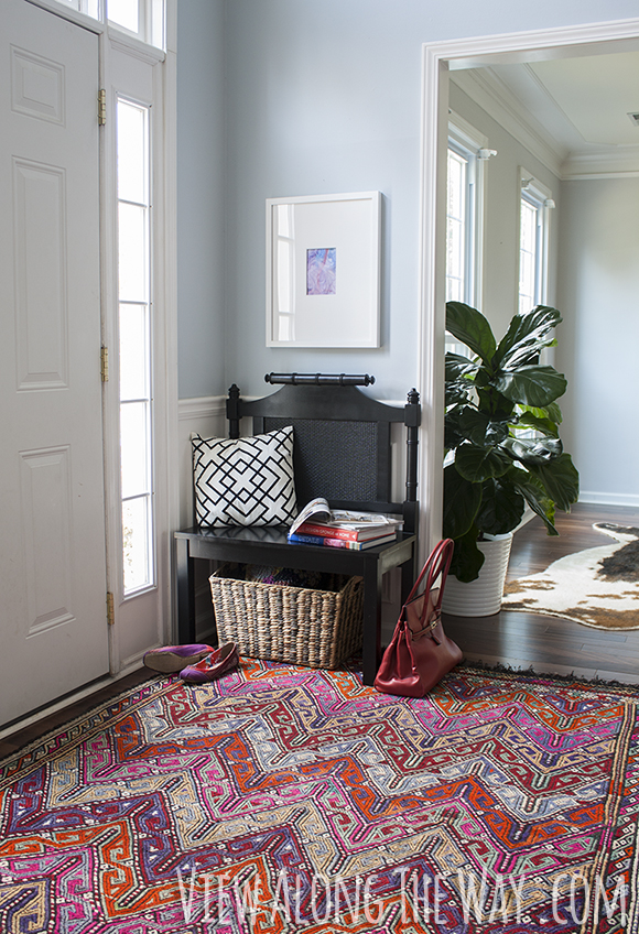 Turn a headboard into a bench for entryway seating!