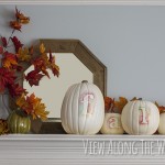 Fall mantle decorated with watercolor pumpkins and fall leaves