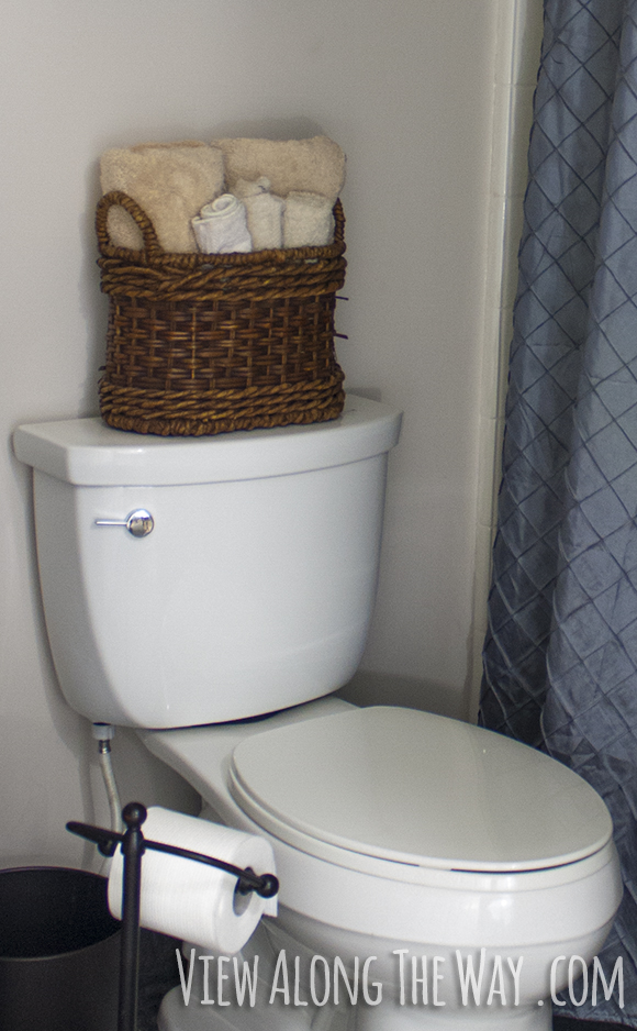 Rolled up towels make a luxurious guest bathroom