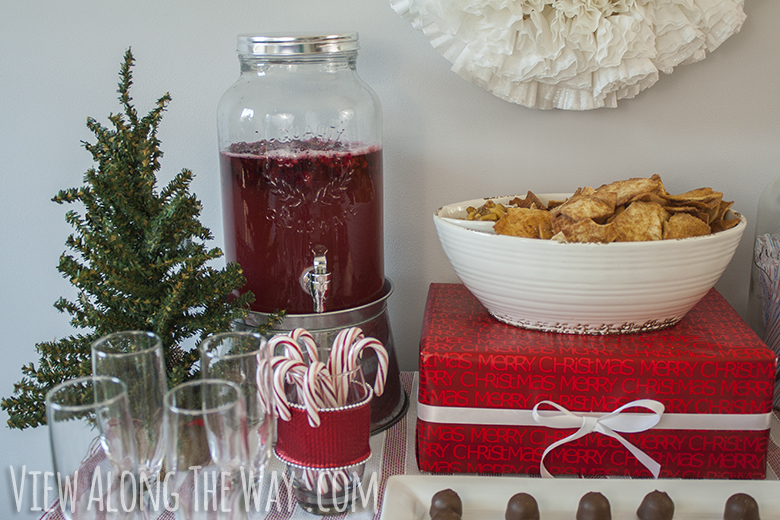 Recipe for red fruited Christmas punch in a mason jar dispenser!
