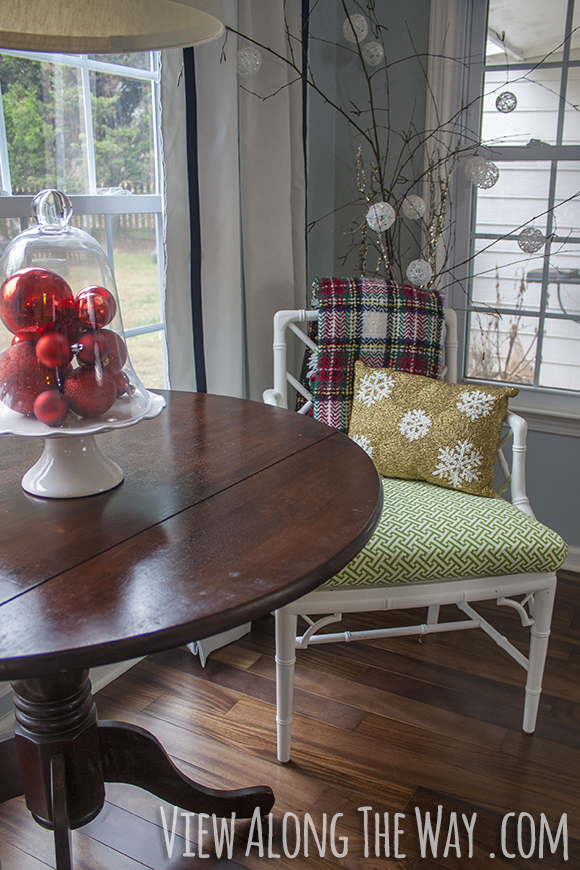 Add ornaments to a simple glass cloche for a pretty, easy Christmas centerpiece!