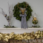 Christmas mantel: brass deer with greenery and a DIY golden magnolia garland!