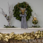 Christmas mantel at View Along the Way: Brass, greenery and black and white ribbon.