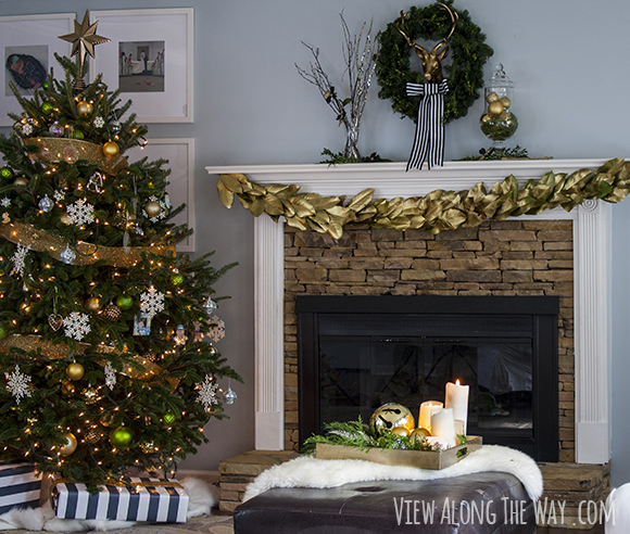 Living room with gold, black and white accents for Christmas at www.viewalongtheway.com.