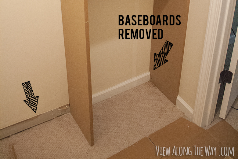 Removing baseboards to install custom shelf unit