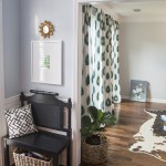 Patterned curtains and a colorful rug